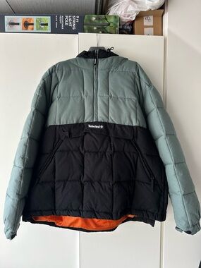 Timberland Two-Tone Puffer Jacket in Sage Green and Black with Orange Lining